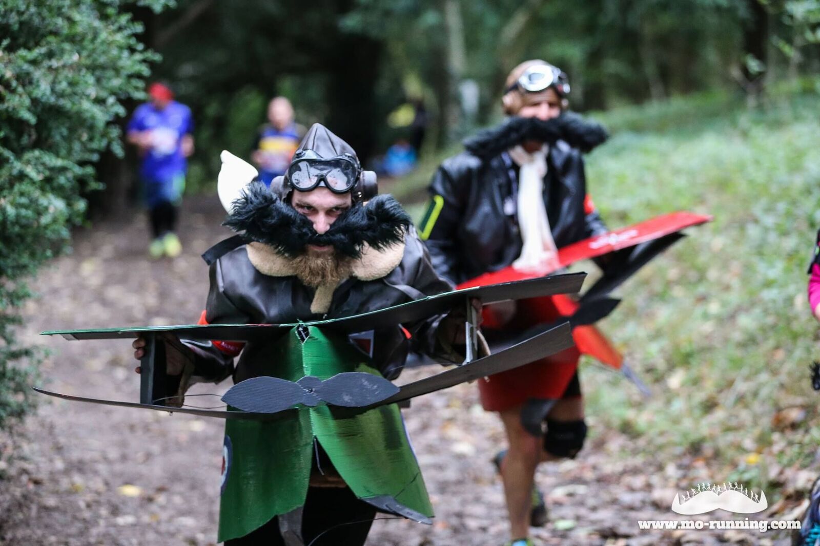 Image of runners dressed up as old fashioned pilots